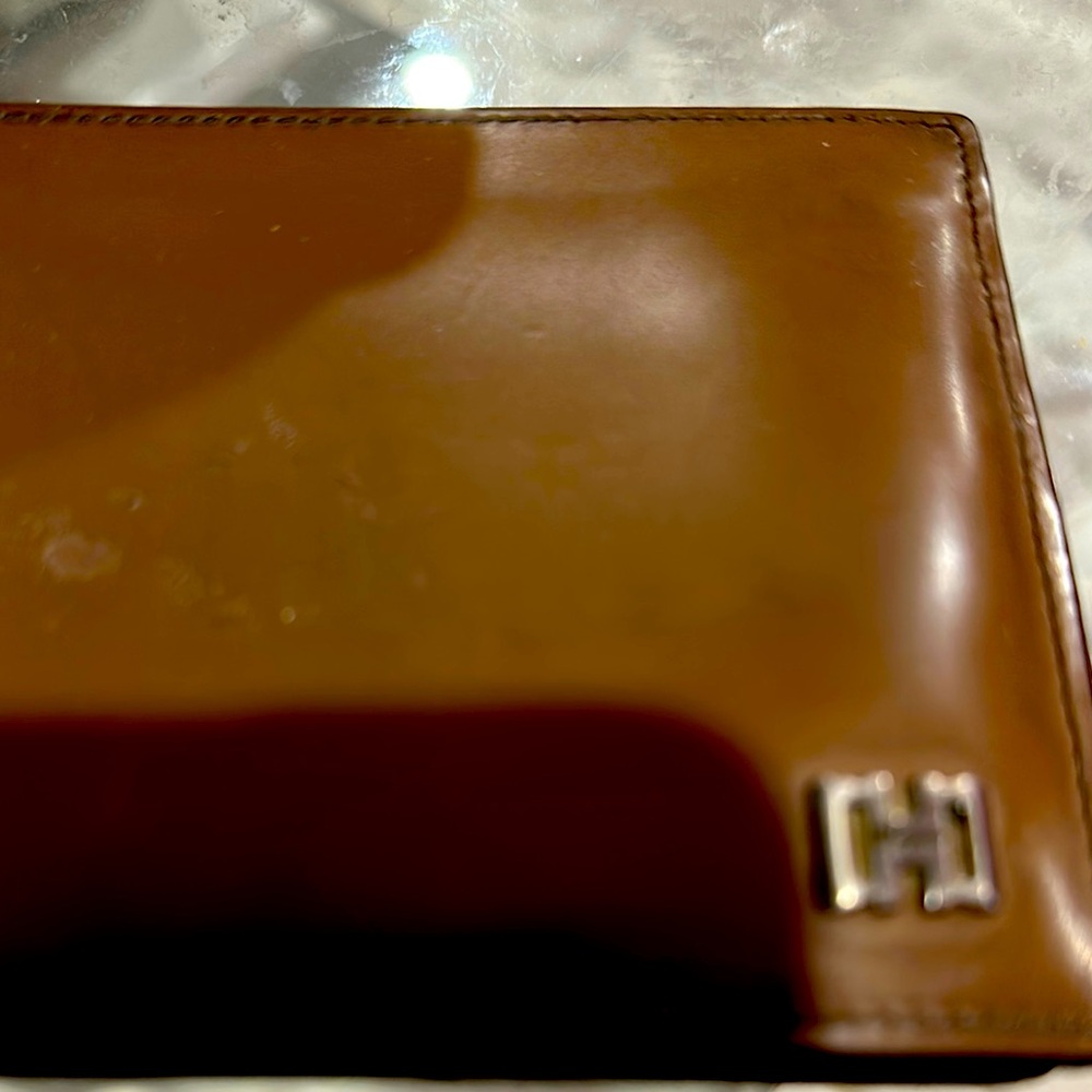 Ferragamo Brown Wallet with Silver Logo. Is used and Has scuffs
